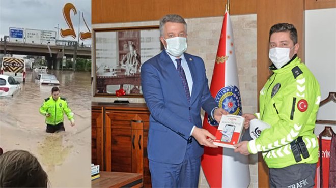 İzmir’de beline kadar suya girip vatandaşlara yardım eden polise ödül